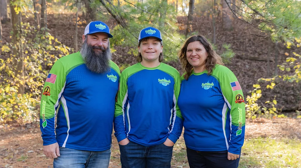 Garrett, Jaxon and Allison Bosqui in SoftWash Systems uniforms, the family that owns the St. Louis County location