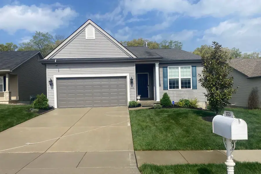 Clean grey vinyl siding and white trim on a St. Louis County home after a soft wash
